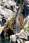 View of waterfall through rock in Languedoc, France