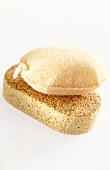 Close-up of two loofahs on white background