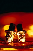 Close-up of silver skull and cylindric shaped studs in dracula look