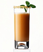 Glass of sea buckthorn juice on white background
