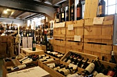 Wine bottles in wooden crates at wine cellar of restaurant, Switzerland
