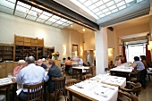People sitting at table in restaurant, Belgium