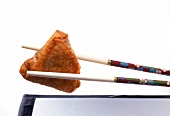 Close-up of chopsticks with ground beef dim sum