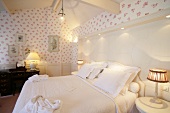 View of luxurious hotel bedroom with patterned wallpaper, Belgium
