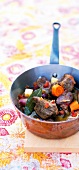 Veal stew with Mediterranean spices in pan