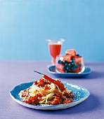 Spaghetti with tomato and chilli sauce on plate