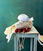 Stack of various Italian salami on stool