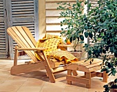 Garden terrace with deck chair and footstool cedar