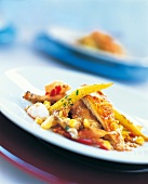 Close-up of spring chicken stuffed with artichokes on plate