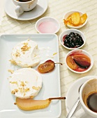 Fresh cheese made from orange yogurt with fruits on plate