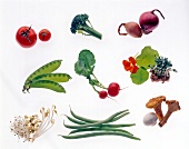 Radish, beans, broccoli, tomatoes and other vegetables on white background