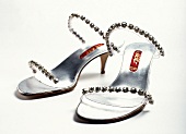 Sandals with diamond and stiletto heel on white background