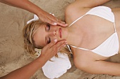 Overhead view of pretty woman receiving massage, eyes closed