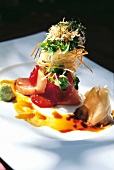 Close-up of yellow fin tuna sashimi with wasabi sauce, pumpkin seed oil and soy sauce