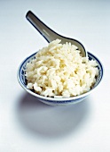 Bowl of rice on white background