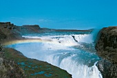 View of waterfall, rock and blue sky