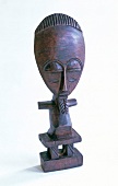 Black fertility doll made of osage wood in ethic style
