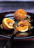 Close-up of potato dumplings with apricot filling on plate