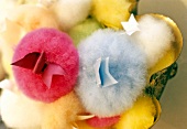 Close-up of powder puffs in different sizes and colours