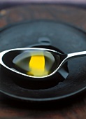 Close-up of olive oil in spoon