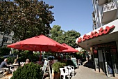 Exterior of ice-cream parlour with parasol, Germany