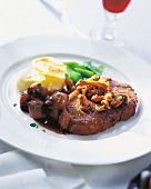 Entrecote and shallot in red wine served on plate