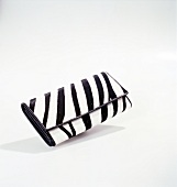 Close-up of black and white zebra print wallet