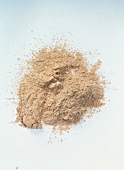 Close-up of loose powder on white background