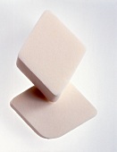 Close-up of two small sponges used for applying make-up on white background