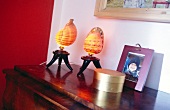 Two yellow shell shaped table lamps on table