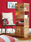 Revolving bookcase made of breu-wood with bins braid chair