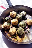 Dumplings with sage and butter in sauce pan