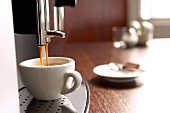 Close-up of freshly brewed coffee from coffee machine