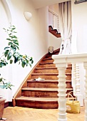 Wooden staircase with turned columns on the railing