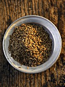 A plate of fennel seeds (seen from above)