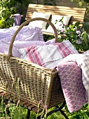 Close-up of basket with pillows in a garden