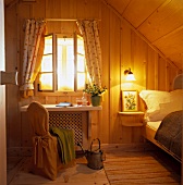 Rustic hotel room with wooden panelling in mountain lodge