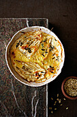 Gratin with fennel in casserole on table, overhead view