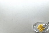 Noodles on plate, white background, copy space