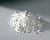 Heap of wheat flour on white background