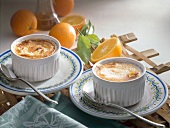 Baked eggs and oranges in ramekins