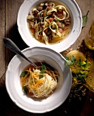 Two bowls of tagiatelle with chicken liver and capelli d'angelo