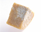 Close-up of tyrolean gray cheese on white background