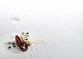 Lobster, spaghetti, clams and white wine on white background, copy space