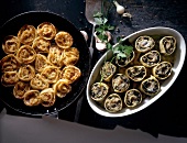 Herb donut and cannelloni stuffed with liver in serving dishes