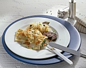 Ravioli with blood sausage and sauerkraut on plate