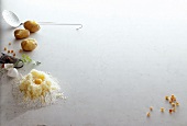 Potatoes, egg yolk, egg shell, nutmeg and breadcrumbs on white background, copy space