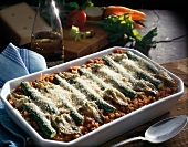 Pasta gratin with young zucchini in casserole