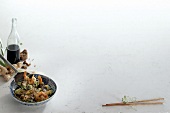 Shrimp with rice noodles in bowl on white background, copy space