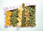 Different types of raw noodles drying on cloth
